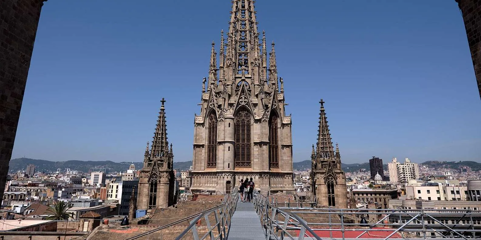 Barcelona Cathedral's central Gothic spire and rooftop terrace walkway high above the Gothic Quarter skyline